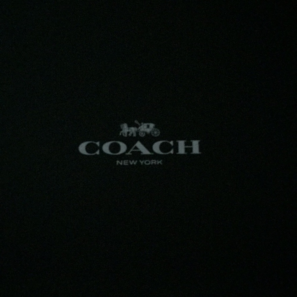 Black leather Coach boots